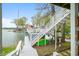 Lakefront property features a private dock with boat slip, kayak, and a staircase leading to an upper deck at 7456 Heather Ct, Nineveh, IN 46164