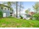 Exterior of the home with lush green lawn, lake access, dock and two-story deck overlooking serene lake at 7456 Heather Ct, Nineveh, IN 46164