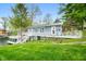 Charming lakeside home with a spacious deck and stairs leading to the water at 7456 Heather Ct, Nineveh, IN 46164
