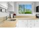 Kitchen featuring granite countertops, stainless sink, and white cabinets at 7456 Heather Ct, Nineveh, IN 46164