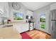 Bright kitchen featuring white cabinets, stainless steel appliances, and view to backyard at 7456 Heather Ct, Nineveh, IN 46164