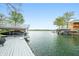 Scenic lake view showcasing the expansive waterfront, docks, boat slips, and peaceful surroundings at 7456 Heather Ct, Nineveh, IN 46164