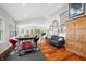 Bright living room with hardwood floors, neutral paint, and dining area at 7456 Heather Ct, Nineveh, IN 46164