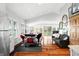Bright living room with hardwood floors, neutral paint, and dining area at 7456 Heather Ct, Nineveh, IN 46164