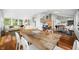 This living room is open and airy, with hardwood floors, natural light, and a dining area that is great for entertaining at 7456 Heather Ct, Nineveh, IN 46164