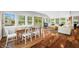 Living room features hardwood floors, natural light, and a view of the water that creates a relaxing atmosphere at 7456 Heather Ct, Nineveh, IN 46164