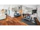 Living area showcases hardwood floors, a comfortable sitting area, decorous wall decor, and an abundance of natural light at 7456 Heather Ct, Nineveh, IN 46164