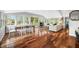 The interior living space features hardwood floors, natural light, and a comfortable seating area with a view of the water at 7456 Heather Ct, Nineveh, IN 46164
