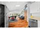 Bright living room with skylight, hardwood floors, and view of the lake at 7456 Heather Ct, Nineveh, IN 46164
