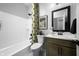 Well-lit bathroom features a shower over tub, modern fixtures, and stylish decor at 769 Rose Garden Way, Westfield, IN 46074