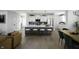 Modern kitchen with white cabinets, quartz countertops, a large island with seating, and stainless steel appliances at 769 Rose Garden Way, Westfield, IN 46074