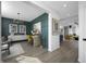 View of the modern living room with hardwood floors, wainscotting, designer lighting, and open concept design at 769 Rose Garden Way, Westfield, IN 46074