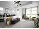 Spacious main bedroom with large windows, tray ceiling, and a beautifully designed accent wall at 769 Rose Garden Way, Westfield, IN 46074