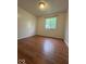 Bedroom with hardwood flooring and window at 7833 Broadview Dr, Indianapolis, IN 46227