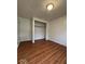 Bedroom with hardwood flooring, closet and white door at 7833 Broadview Dr, Indianapolis, IN 46227
