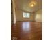 Neutral bedroom featuring a bright window and wood laminate flooring at 7833 Broadview Dr, Indianapolis, IN 46227