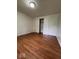 Bedroom featuring laminate wood flooring, and closet at 7833 Broadview Dr, Indianapolis, IN 46227
