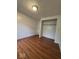 Bedroom with hardwood flooring, closet and white door at 7833 Broadview Dr, Indianapolis, IN 46227