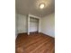 Bedroom with hardwood flooring, closet and white door at 7833 Broadview Dr, Indianapolis, IN 46227