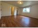A bedroom with a window and view into the bathroom and closet at 7833 Broadview Dr, Indianapolis, IN 46227