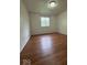 Bedroom featuring a window and wood laminate flooring at 7833 Broadview Dr, Indianapolis, IN 46227