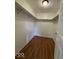 Walk-in closet featuring wood laminate flooring and shelving with supports at 7833 Broadview Dr, Indianapolis, IN 46227