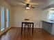 Bright dining area with wood floors, a modern table, and a convenient kitchen counter nearby at 7833 Broadview Dr, Indianapolis, IN 46227
