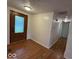 Inviting entryway with wood floors, a decorative front door, and access to various rooms at 7833 Broadview Dr, Indianapolis, IN 46227