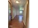 Inviting home foyer featuring wood floors and a clear view to the spacious living areas at 7833 Broadview Dr, Indianapolis, IN 46227
