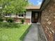 Home exterior with a brick facade, well-kept yard, and a welcoming front entrance at 7833 Broadview Dr, Indianapolis, IN 46227