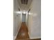 Long hallway leading into home featuring laminate flooring and a closet at 7833 Broadview Dr, Indianapolis, IN 46227
