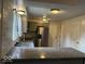 Updated kitchen with granite countertops, stainless steel appliances, and modern lighting fixtures at 7833 Broadview Dr, Indianapolis, IN 46227