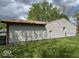Home exterior with gray siding and a well-maintained lawn at 7833 Broadview Dr, Indianapolis, IN 46227