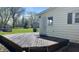 Backyard deck, with a step-down design, offers ample space for outdoor activities and enjoyment at 8200 E Desoto St, Muncie, IN 47303