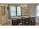 Inviting dining area with rustic wooden table set for a meal, complemented by matching cabinets at 8200 E Desoto St, Muncie, IN 47303