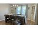 Charming dining room featuring a rustic table setting with wood floors and natural light at 8200 E Desoto St, Muncie, IN 47303