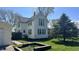 Charming exterior view of a two-story home with green shutters and well-maintained landscaping at 8200 E Desoto St, Muncie, IN 47303