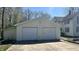 Spacious two-car garage with concrete driveway offers convenient parking and storage space at 8200 E Desoto St, Muncie, IN 47303
