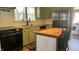Well-lit eat-in kitchen with stainless steel appliances and custom butcher block countertops at 8200 E Desoto St, Muncie, IN 47303