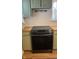 Modern stainless steel range with light green cabinets and wood countertops at 8200 E Desoto St, Muncie, IN 47303
