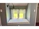 Charming window seat nook with natural light and reading lamp in bedroom at 8200 E Desoto St, Muncie, IN 47303