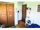 Bedroom features closet space and neutral walls at 8230 E 11Th St, Indianapolis, IN 46219