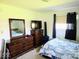 Bedroom with matching dressers and a television at 8230 E 11Th St, Indianapolis, IN 46219