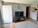 Inviting entryway boasting hardwood floors, neutral paint, and a decorative mirror display at 8230 E 11Th St, Indianapolis, IN 46219