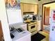Cozy kitchen features a retro-style stove and updated countertops at 8230 E 11Th St, Indianapolis, IN 46219