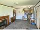 Open living area with fireplace, dining area and access to the kitchen at 8230 E 11Th St, Indianapolis, IN 46219
