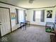 Spacious living room with neutral carpet and updated trim at 8230 E 11Th St, Indianapolis, IN 46219