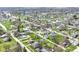 Picturesque aerial view of a charming neighborhood with lush green lawns, mature trees, and diverse home styles at 830 N 16Th St, Elwood, IN 46036