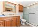 Bathroom featuring a vanity, toilet, and walk-in shower with glass door at 830 N 16Th St, Elwood, IN 46036