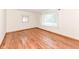 Spacious bedroom featuring wood-look flooring and natural lighting at 830 N 16Th St, Elwood, IN 46036